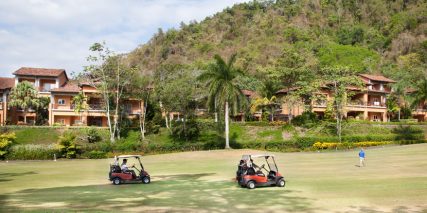 two red golf carts on golf course