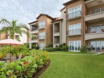 Miramar Residences building with umbrella in front