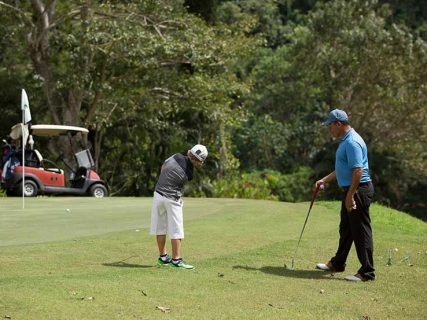 Boy taking golf lessons in Los Sueños